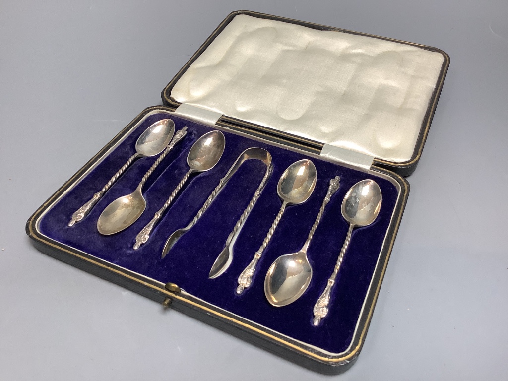 A cased set of six George V silver apostle teaspoons and a pair of sugar tongs, Cooper Brothers & Sons, Sheffield, 1921.